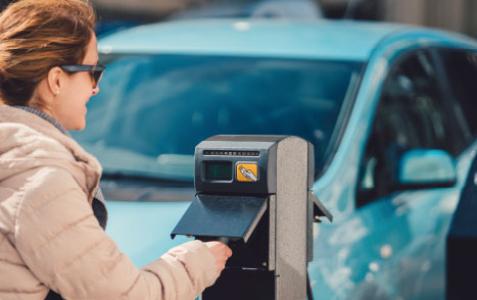 woman at a electric vehicle charge point